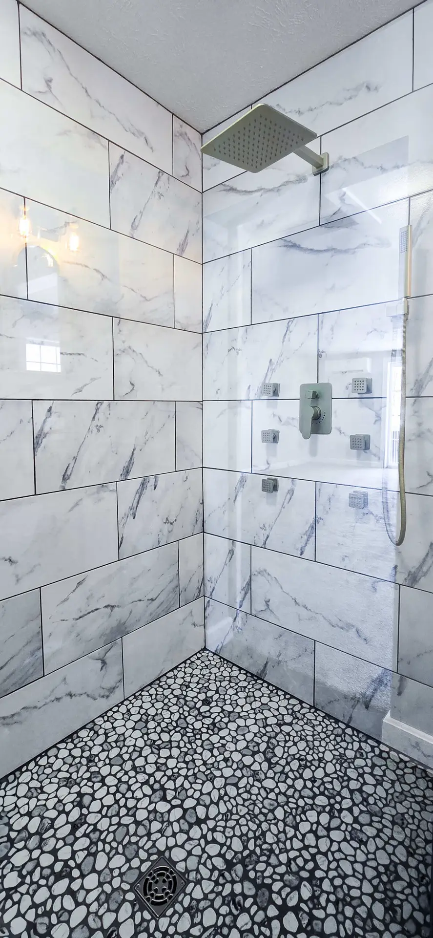 Modern blue vanity bathroom with freestanding marble tub